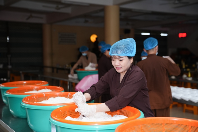 Giving vegetarian vermicelli at Thanh Loc  Paralytic Supporting and Nurturing Center in the Temple's Charity Activities