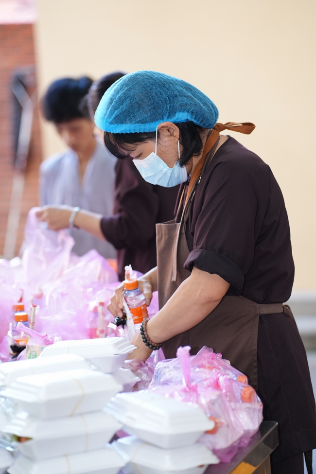 Giving vegetarian vermicelli at Thanh Loc  Paralytic Supporting and Nurturing Center in the Temple's Charity Activities