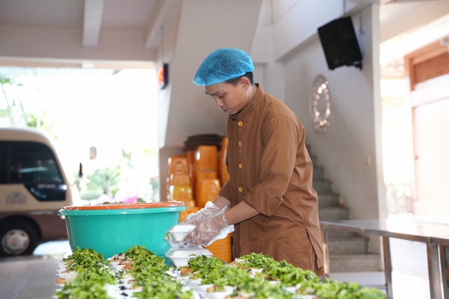 Giving vegetarian vermicelli at Thanh Loc  Paralytic Supporting and Nurturing Center in the Temple's Charity Activities