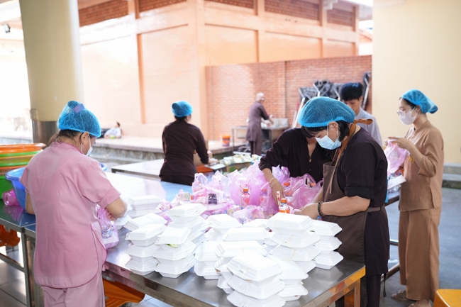 Giving vegetarian vermicelli at Thanh Loc  Paralytic Supporting and Nurturing Center in the Temple's Charity Activities