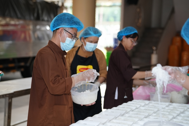 Giving vegetarian vermicelli at Thanh Loc  Paralytic Supporting and Nurturing Center in the Temple's Charity Activities