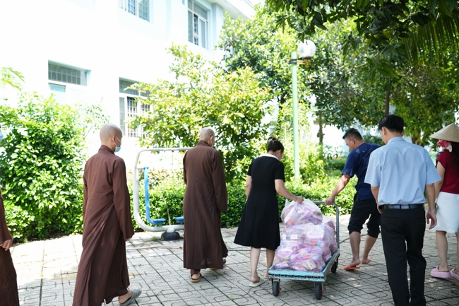 Giving vegetarian vermicelli at Thanh Loc  Paralytic Supporting and Nurturing Center in the Temple's Charity Activities