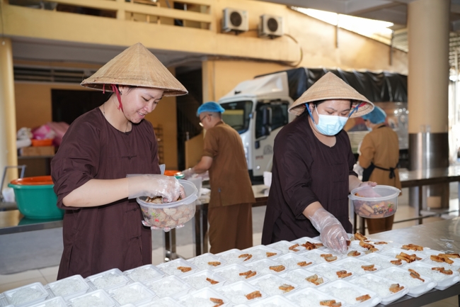 Giving vegetarian vermicelli at Thanh Loc  Paralytic Supporting and Nurturing Center in the Temple's Charity Activities